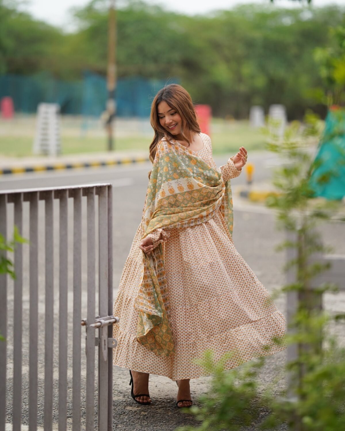 Creamy yellow tiered anarkali set