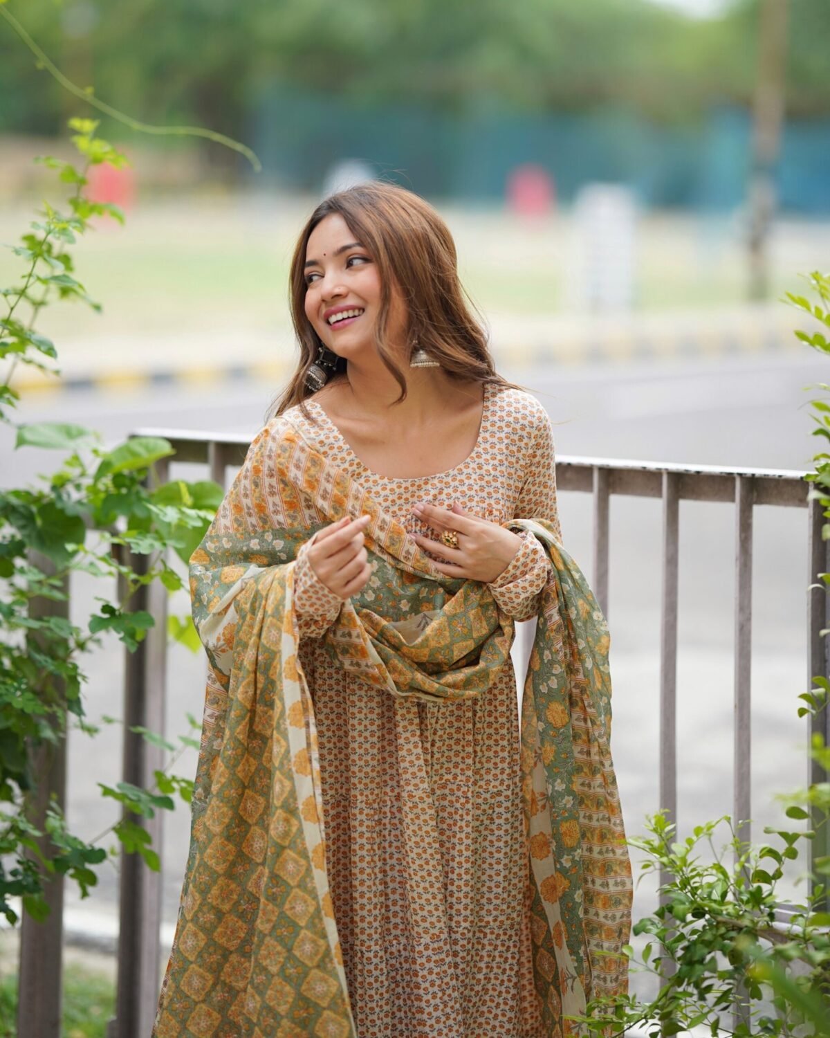 Creamy yellow tiered anarkali set