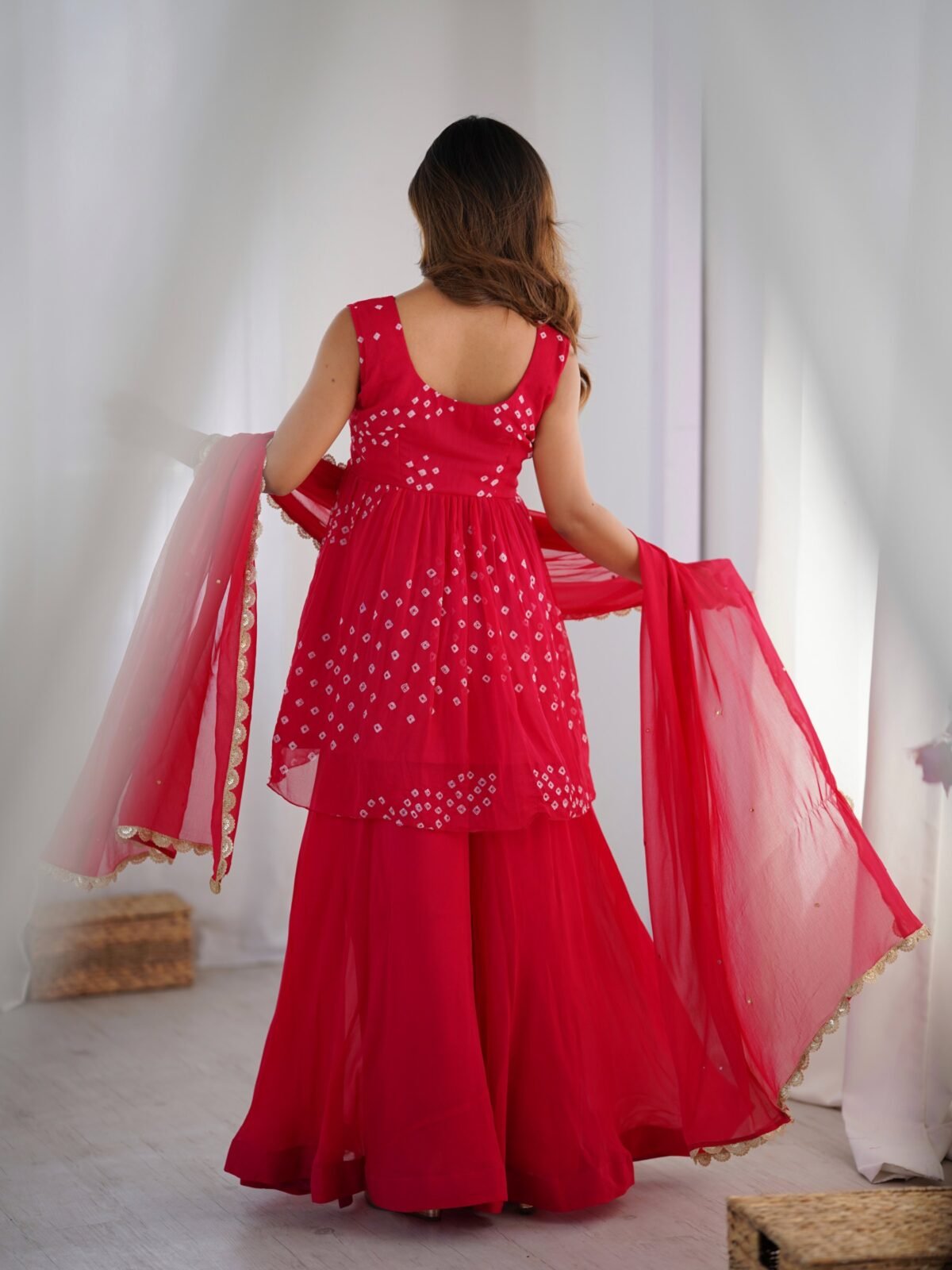 Crimson pink bpeplum kurta and flared palazzo set