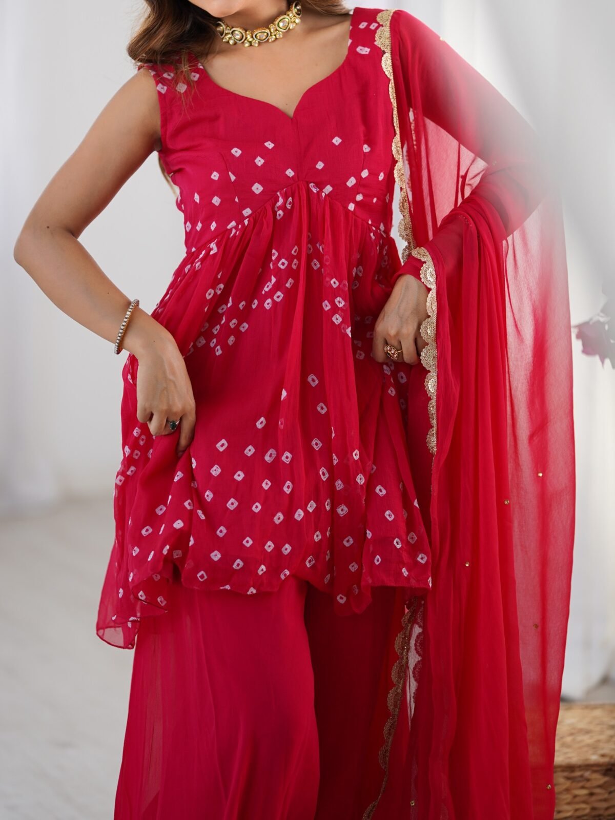 Crimson pink bpeplum kurta and flared palazzo set