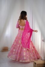 Pink tiered lehenga with blouse and magenta dupatta