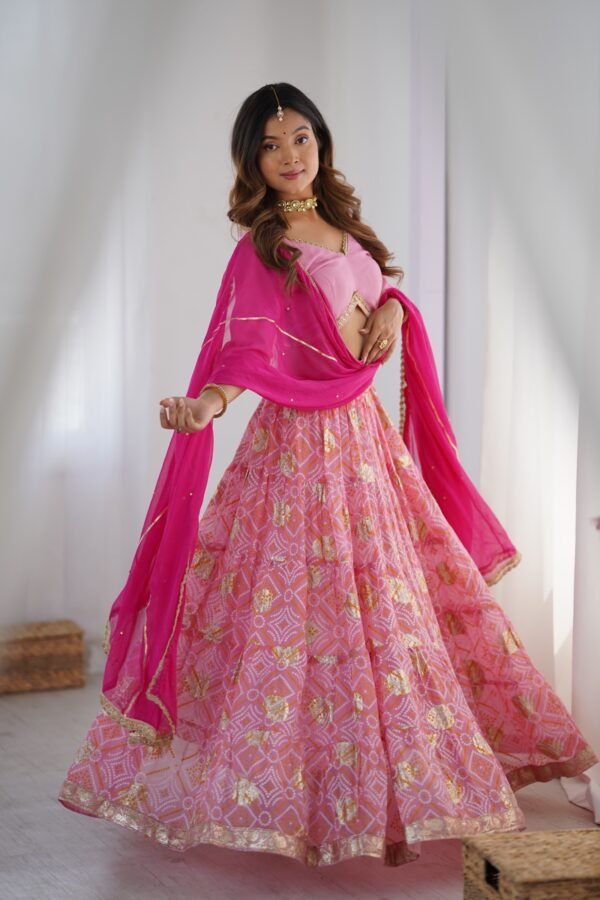 Pink tiered lehenga with blouse and magenta dupatta
