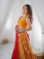Yellow bandhani printed lehenga with blouse and red dupatta