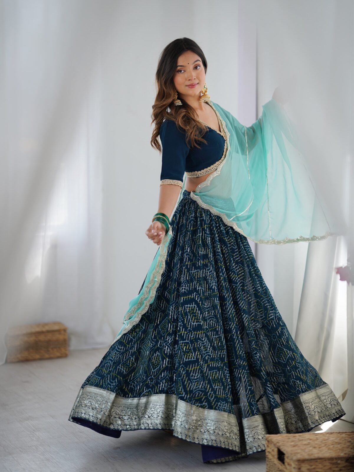 Teal blue lehenga with blouse and powder blue dupatta
