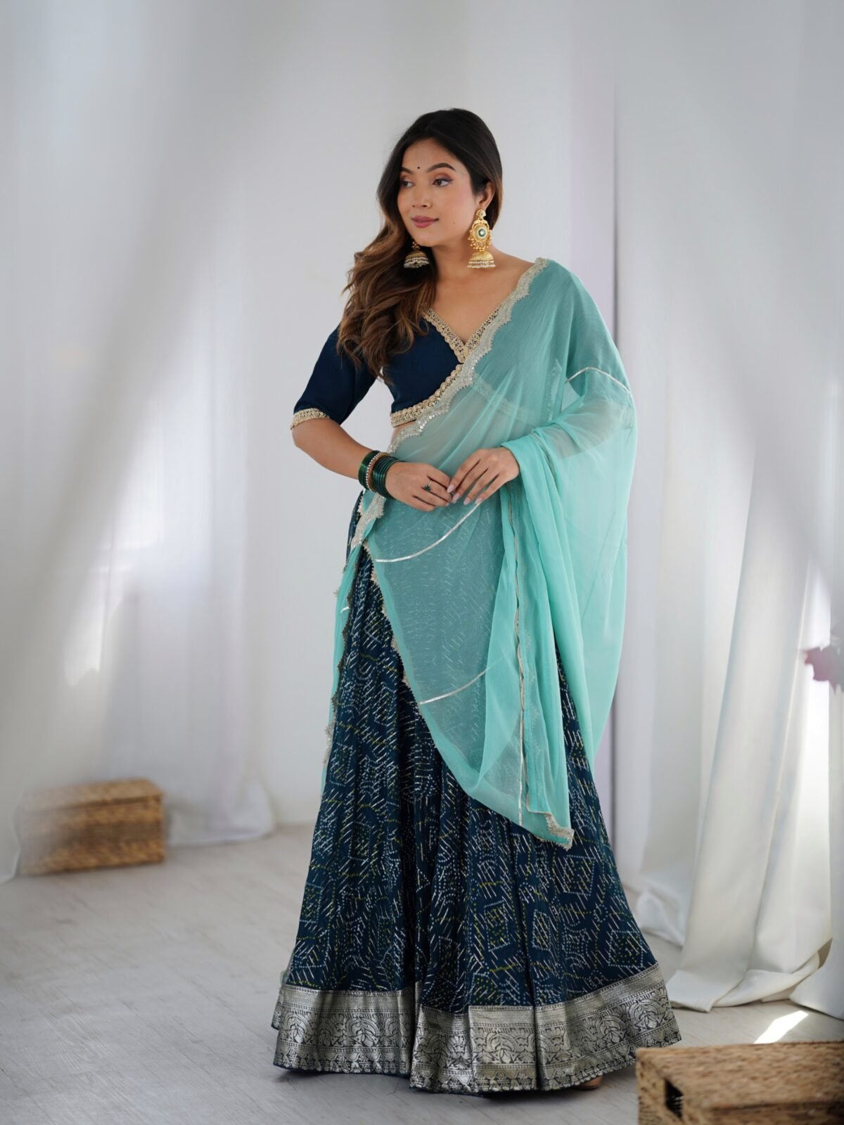 Teal blue lehenga with blouse and powder blue dupatta