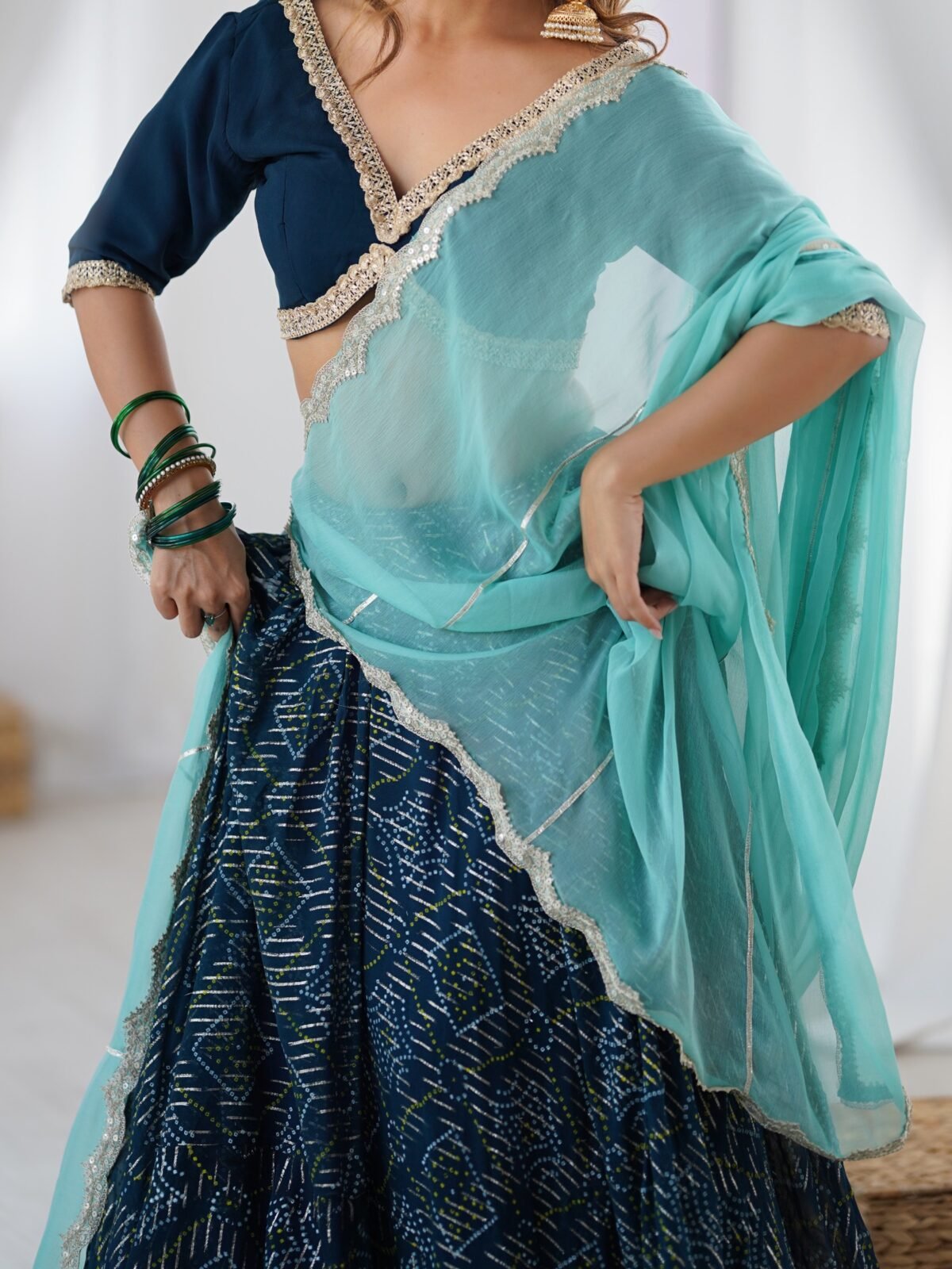 Teal blue lehenga with blouse and powder blue dupatta