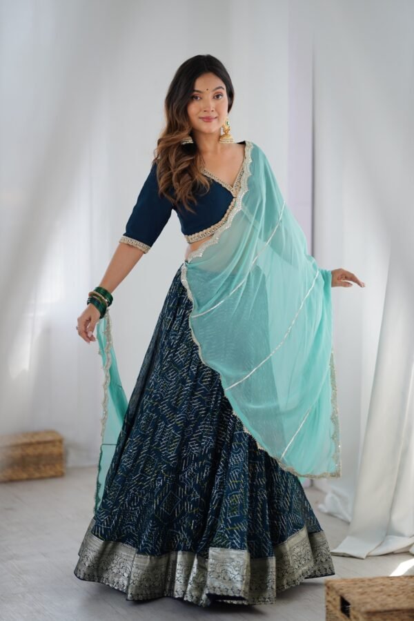 Teal blue lehenga with blouse and powder blue dupatta